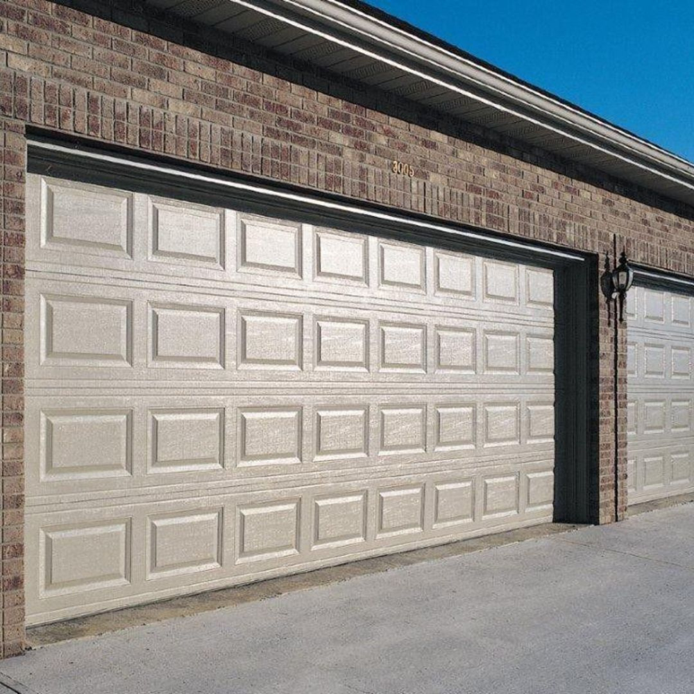 Satisfied customer with new garage door installation
